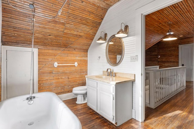 bathroom with vaulted ceiling, wooden ceiling, and wood walls