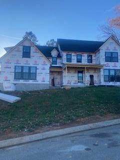 view of front of property with a front lawn