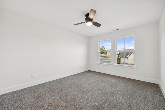 3511 Hawks Creek Dr, Apison, TN 37302 - spare room featuring baseboards, visible vents, dark colored carpet, and a ceiling fan