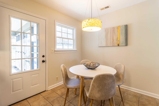 dining room with tile patterned floors