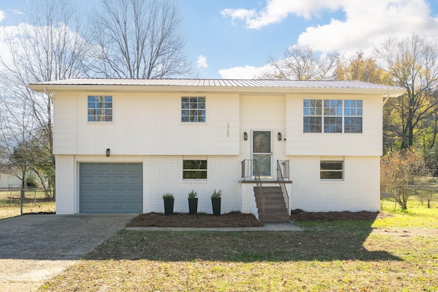 raised ranch featuring a garage