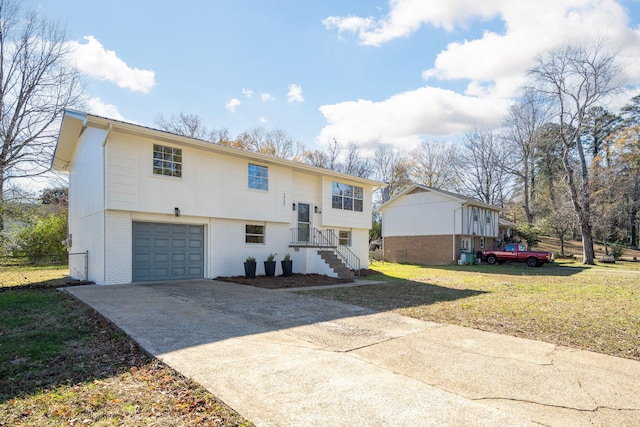 split foyer home featuring a front yard and a garage