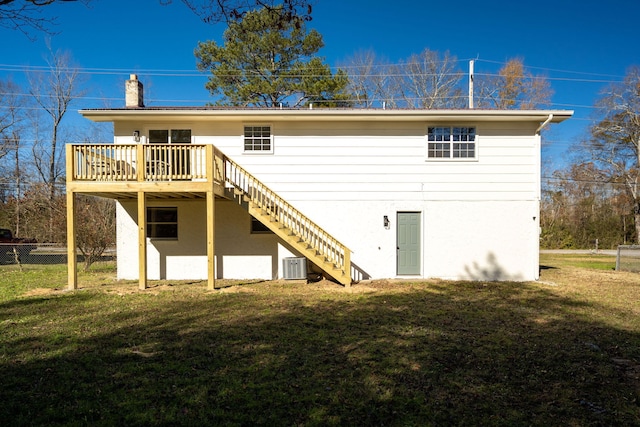 back of house featuring a yard, cooling unit, and a deck