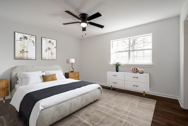 bedroom featuring ceiling fan and wood-type flooring