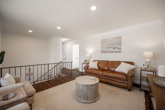 living room featuring dark wood-type flooring and ornamental molding