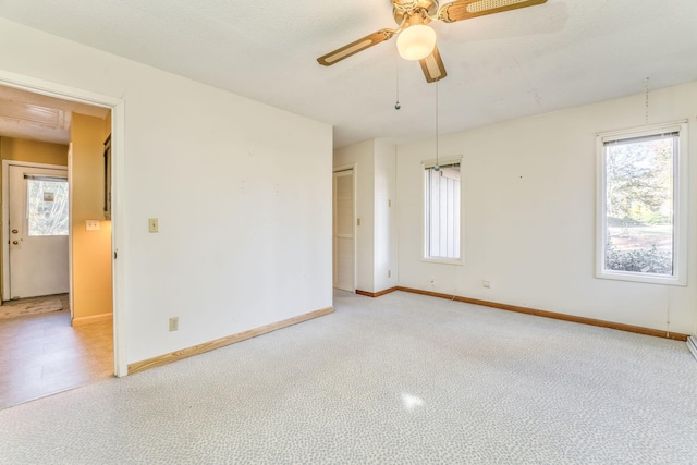 spare room featuring ceiling fan and a textured ceiling