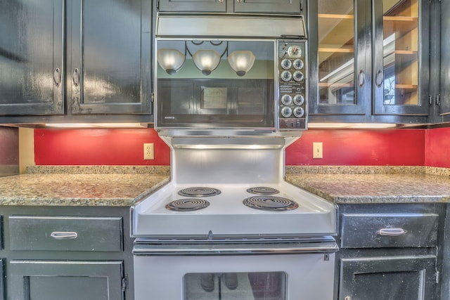 kitchen featuring white range with electric stovetop