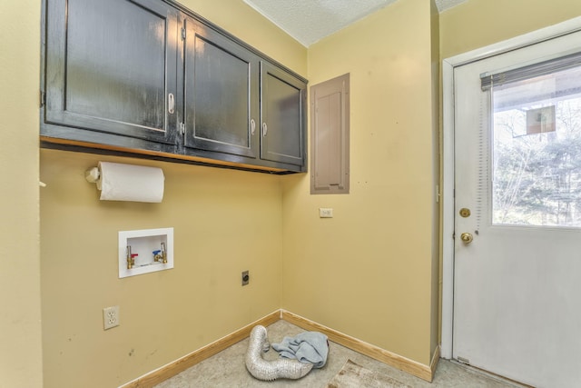 washroom featuring hookup for an electric dryer, cabinets, a textured ceiling, and hookup for a washing machine