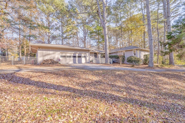 ranch-style home featuring a garage