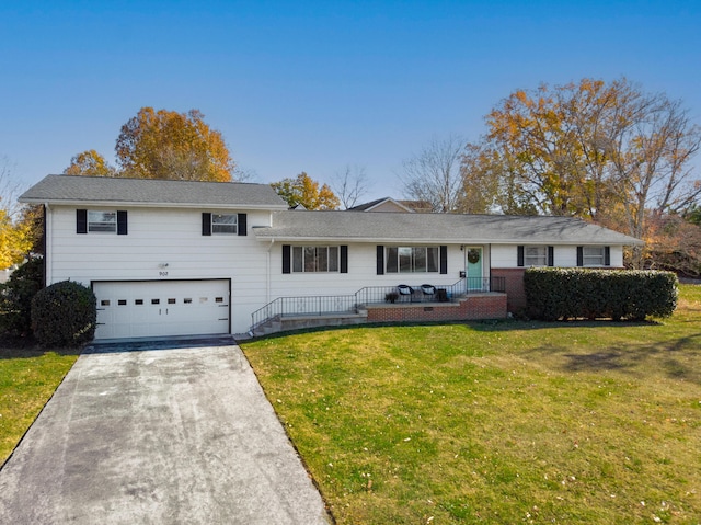 view of front facade featuring a garage and a front lawn