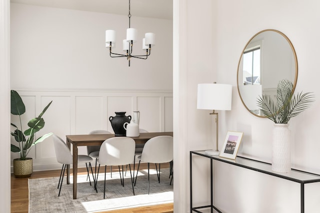 interior space featuring hardwood / wood-style floors and an inviting chandelier