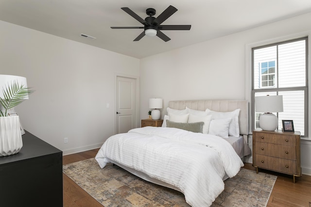 bedroom featuring dark hardwood / wood-style floors and ceiling fan