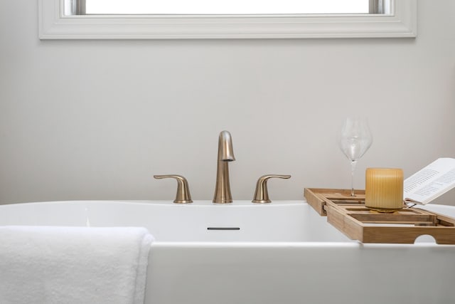 details with a bathing tub and sink