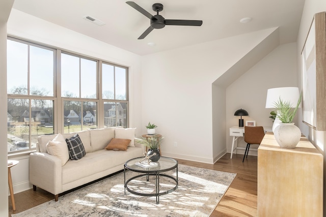 living room with ceiling fan and wood-type flooring