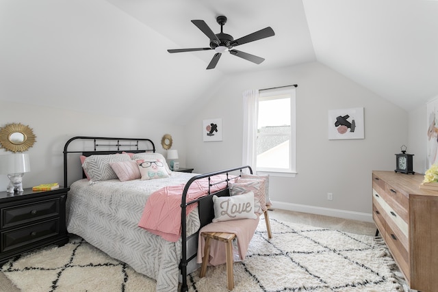 bedroom with light colored carpet, vaulted ceiling, and ceiling fan