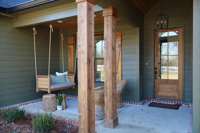 entrance to property featuring a porch