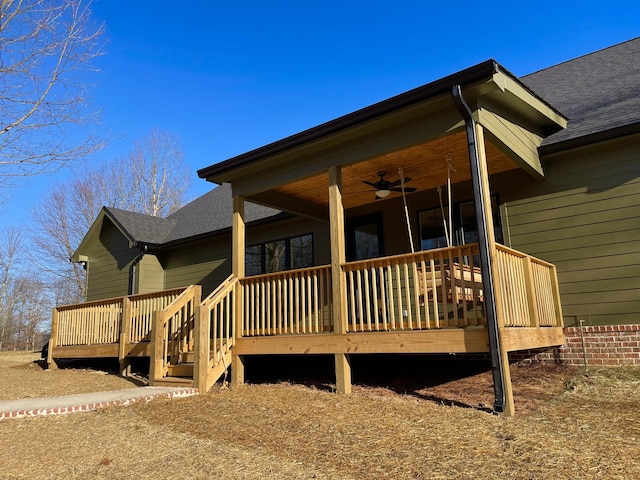 view of home's exterior featuring a porch, a deck, and ceiling fan