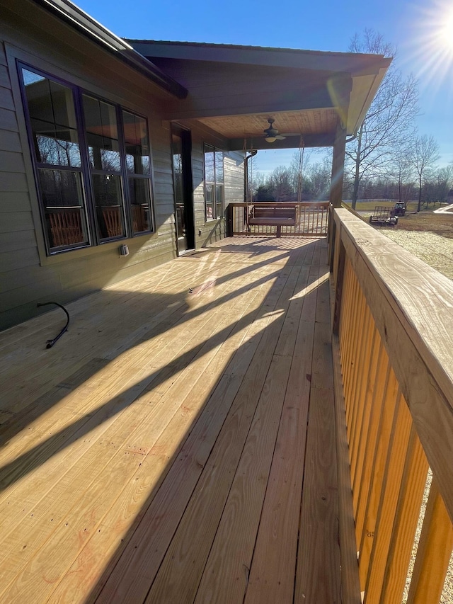 wooden deck with ceiling fan