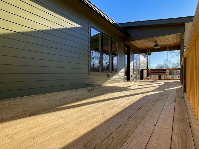 deck featuring a porch and ceiling fan