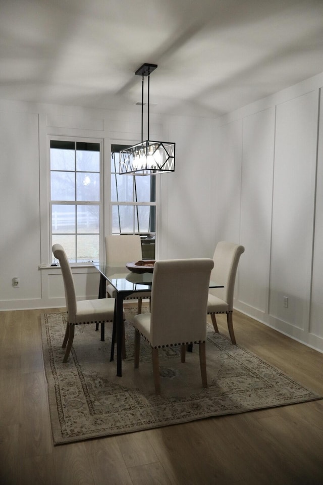 dining space featuring wood-type flooring