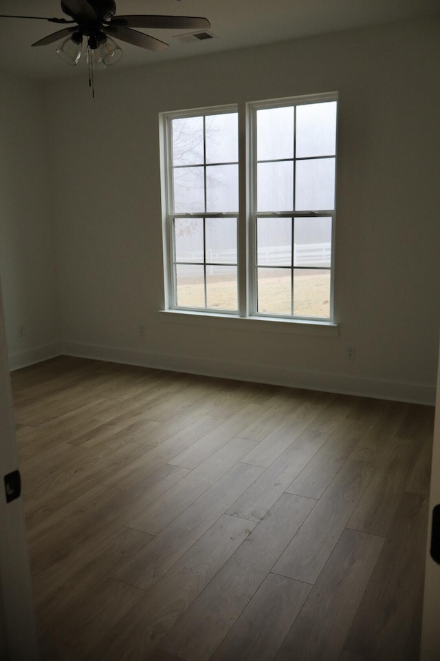 spare room featuring ceiling fan and wood-type flooring