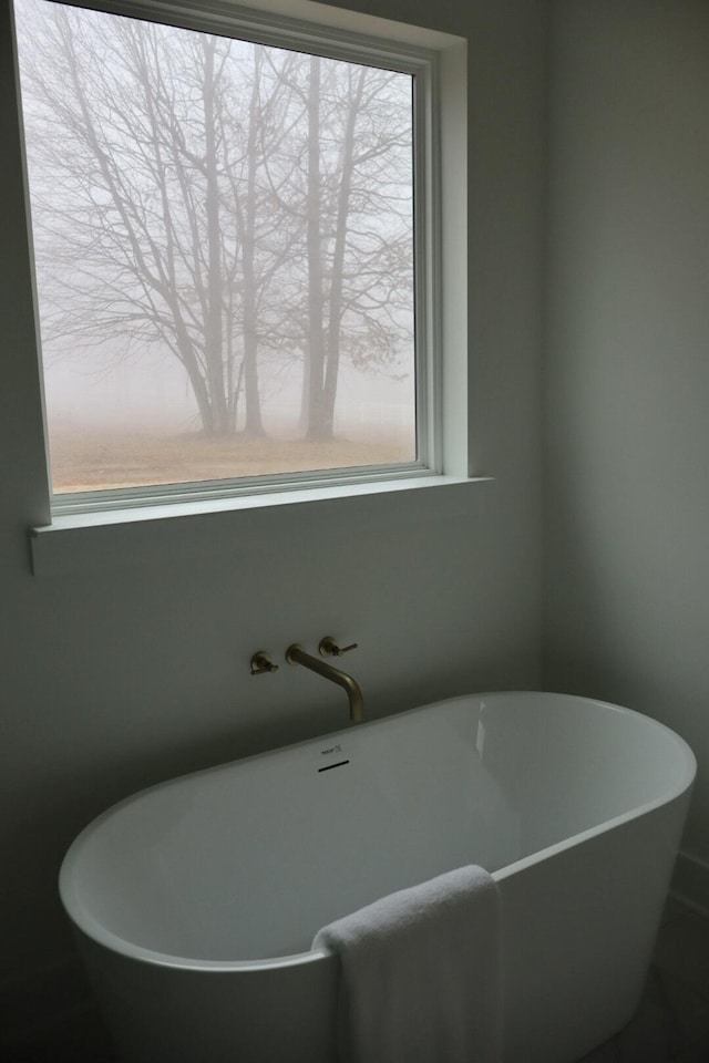 bathroom featuring a tub