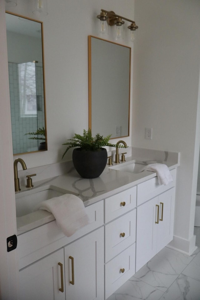 bathroom featuring toilet and vanity