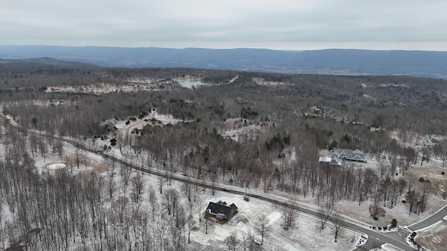 snowy aerial view with a mountain view