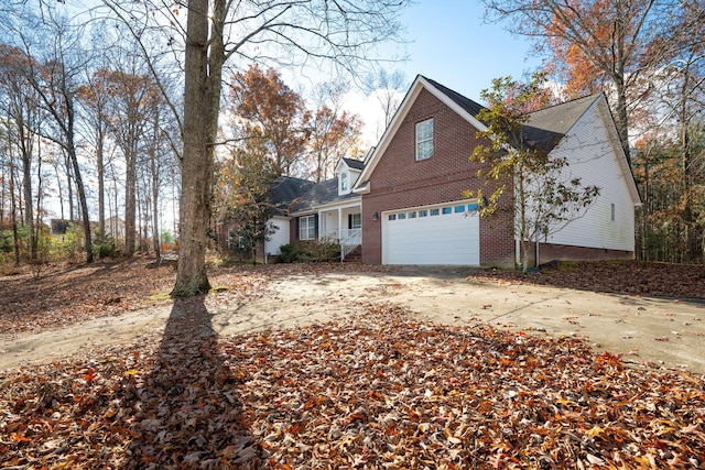 view of side of property featuring a garage