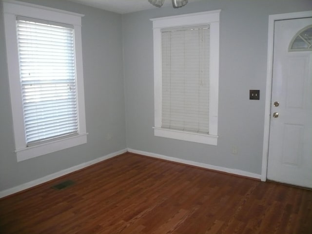 foyer entrance with dark hardwood / wood-style floors