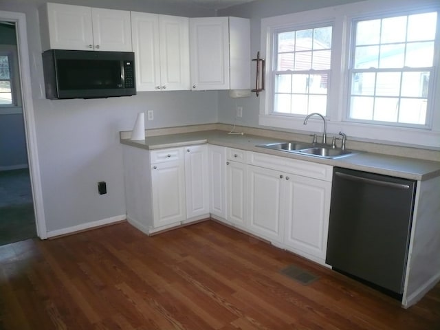 kitchen with stainless steel dishwasher, dark hardwood / wood-style flooring, white cabinets, and sink