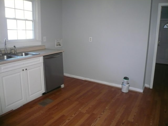 kitchen featuring stainless steel dishwasher, dark hardwood / wood-style flooring, white cabinets, and sink