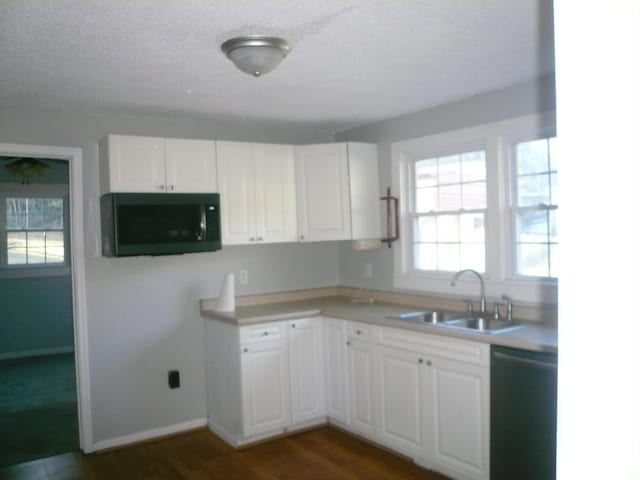 kitchen featuring dark hardwood / wood-style flooring, sink, white cabinetry, and black appliances