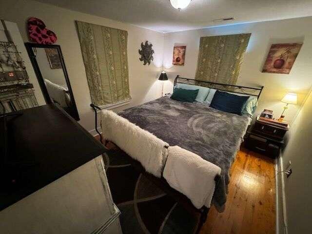 bedroom with light hardwood / wood-style flooring