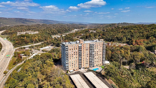 birds eye view of property with a mountain view