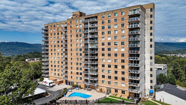 view of building exterior featuring a mountain view