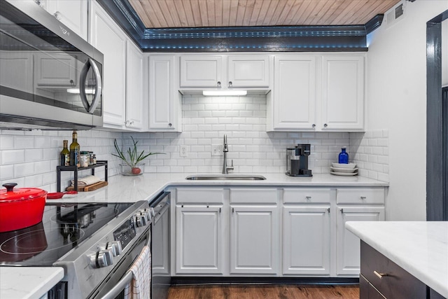 kitchen with white cabinets, stainless steel appliances, and sink