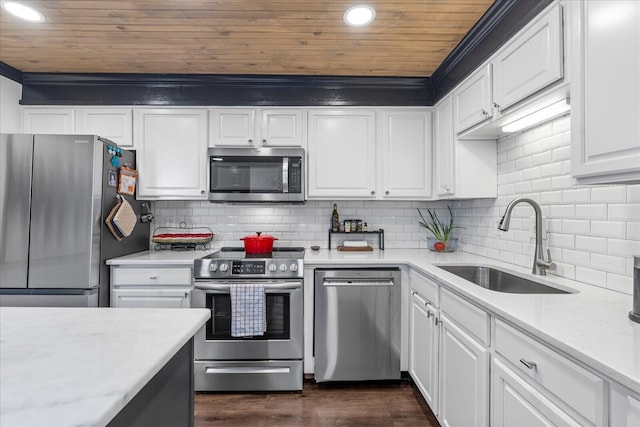 kitchen with appliances with stainless steel finishes, sink, tasteful backsplash, and wood ceiling