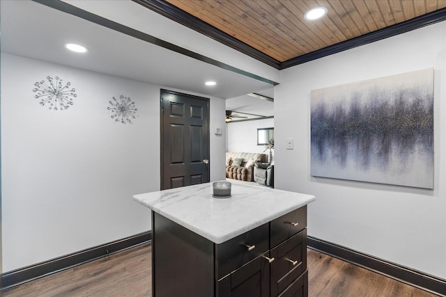 kitchen featuring ceiling fan, a center island, wooden ceiling, and dark wood-type flooring