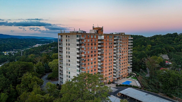 view of outdoor building at dusk