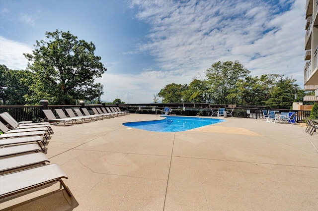 view of swimming pool featuring a patio area