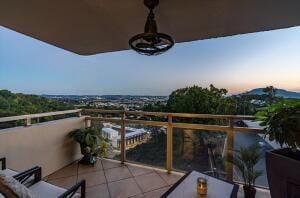 view of balcony at dusk