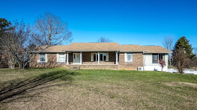 ranch-style house featuring a front lawn