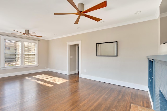 unfurnished living room with baseboards, a ceiling fan, wood finished floors, and crown molding