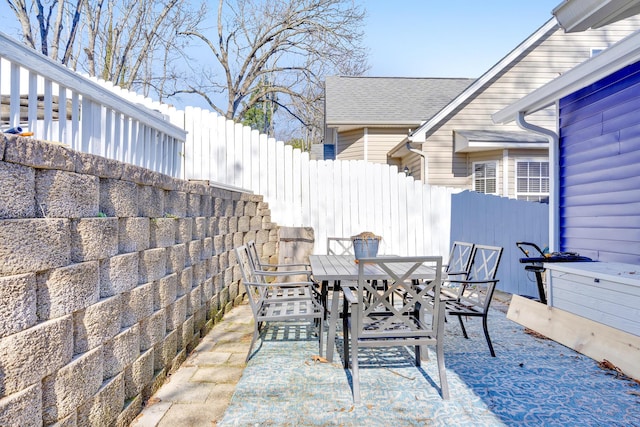 view of patio / terrace featuring outdoor dining space and fence