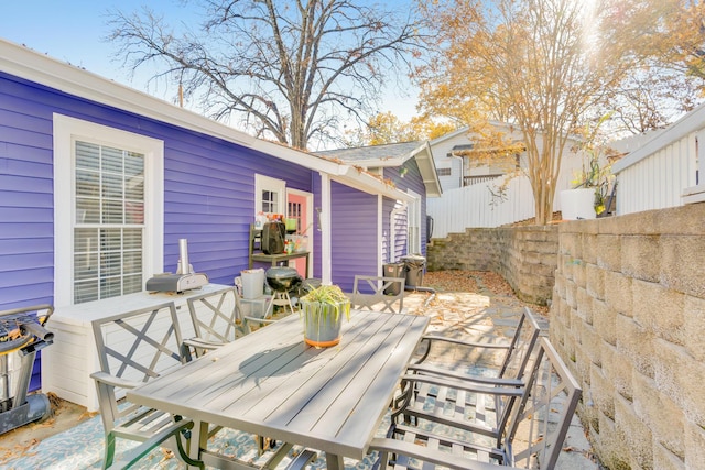 view of patio / terrace with outdoor dining area and fence