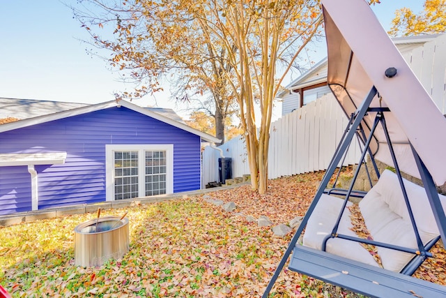 view of yard with an outbuilding and fence