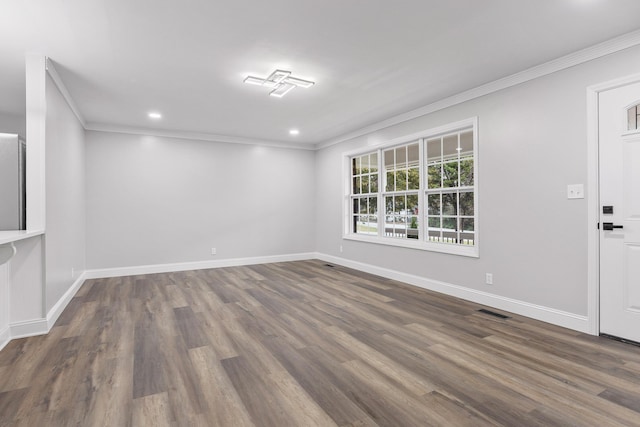 unfurnished room with dark hardwood / wood-style flooring and ornamental molding