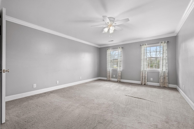 carpeted empty room featuring ceiling fan and ornamental molding