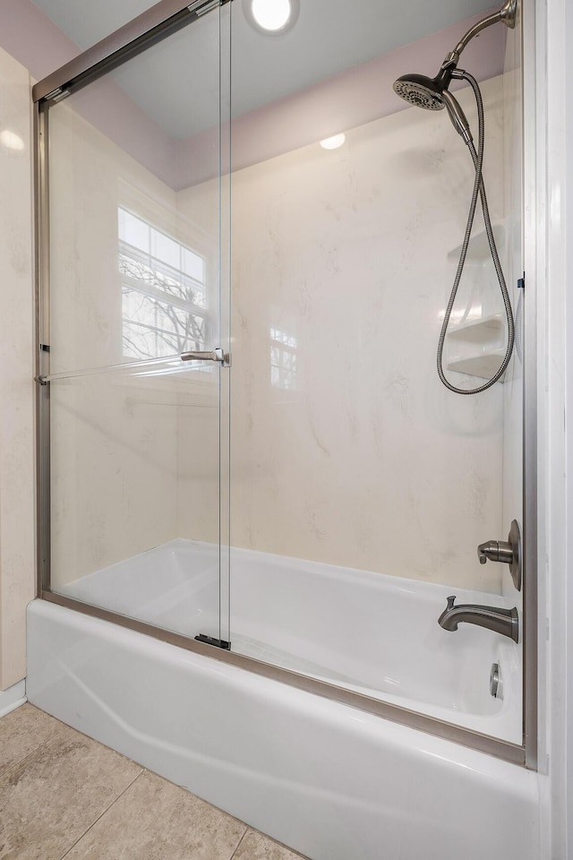 bathroom with tile patterned floors and enclosed tub / shower combo